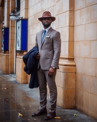 Dark Brown Leather Oxford Shoes Outfits: Teaming a navy overcoat with a grey suit is a great option for a classic and elegant ensemble. Add a pair of dark brown leather oxford shoes to the mix for extra fashion points.
