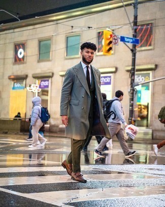 Grey Overcoat Outfits: A grey overcoat and an olive check suit are essential in a grown-up man's wardrobe. Let your outfit coordination credentials truly shine by completing your ensemble with brown leather double monks.