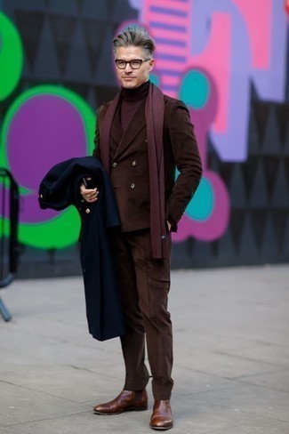 Brown Chelsea Boots with Suit Outfits After 40: This combination of a suit and a navy overcoat is a goofproof option when you need to look like a modern gentleman. Spice up your getup by slipping into a pair of brown chelsea boots. So if you need outfit inspo for dressing in your forties, this ensemble is an amazing example.
