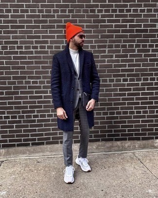 Yellow Beanie Outfits For Men: For an outfit that's super simple but can be worn in plenty of different ways, choose a navy overcoat and a yellow beanie. Feeling inventive today? Jazz things up by slipping into a pair of white athletic shoes.