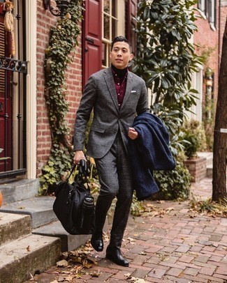 500+ Winter Outfits For Men: One of our favorite ways to style out such an essential piece as a navy overcoat is to team it with a charcoal check wool suit. Introduce a pair of black leather oxford shoes to the mix et voila, this outfit is complete. During the winter months, when functionality is key, it can be easy to settle for a less-than-stylish ensemble in the name of practicality. However, this ensemble is a shining example that you can actually stay warm and remain equally stylish during the winter months.