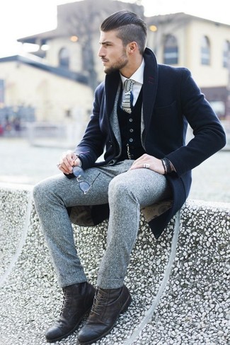 This sophisticated pairing of a navy overcoat and a grey wool suit is a frequent choice among the fashion-savvy gentlemen. A trendy pair of dark brown leather casual boots is the most effective way to add a confident kick to the outfit.