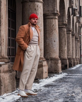 Red Beanie Outfits For Men: To create a casual menswear style with a modern twist, consider teaming a tobacco overcoat with a red beanie. Introduce white leather low top sneakers to the mix for extra style points.