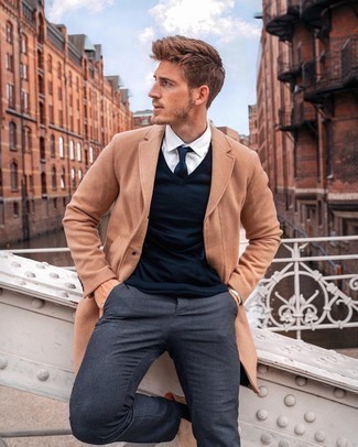 Navy Sweater Vest Outfits For Men: Consider pairing a navy sweater vest with charcoal chinos to achieve an interesting and put together ensemble. A pair of tan suede chelsea boots will immediately smarten up any look.