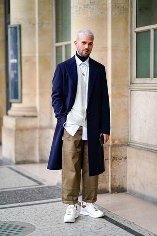 Navy Overcoat Outfits: Putting together a navy overcoat with brown chinos is a great pick for a casually sleek look. If you wish to immediately play down this ensemble with a pair of shoes, add white athletic shoes to your outfit.