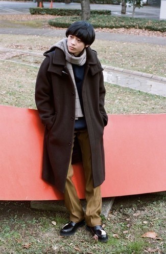 467 Outfits For Men In Their Teens: Elevate your off-duty style game to new heights by putting together a dark brown overcoat and khaki chinos. Black and white leather loafers are guaranteed to breathe a dash of elegance into your outfit. A great source of inspiration if you want to shed your boyish look and start dressing more like an adult.