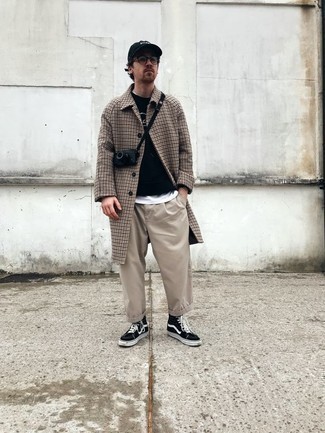 Beige Chinos Casual Outfits: Pair a camel houndstooth overcoat with beige chinos to look truly stylish anywhere anytime. Ramp up your whole ensemble by finishing with a pair of black and white canvas high top sneakers.
