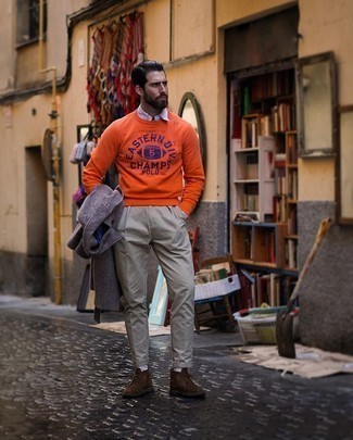 Orange Print Sweatshirt Outfits For Men: This pairing of an orange print sweatshirt and grey chinos is uber stylish and provides a cool and casual look. If you feel like playing it up a bit now, complement your outfit with a pair of dark brown suede desert boots.