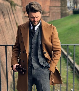Charcoal Wool Three Piece Suit Outfits: This combination of a charcoal wool three piece suit and a camel overcoat is a never-failing option when you need to look truly sharp and elegant.