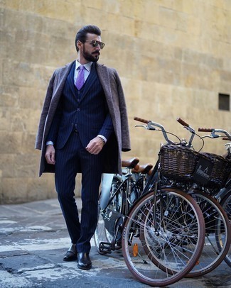 Charcoal Herringbone Overcoat Outfits: You're looking at the definitive proof that a charcoal herringbone overcoat and a navy vertical striped three piece suit are awesome when paired together in a sophisticated look for today's gent. To add a hint of stylish nonchalance to this look, complement your ensemble with black leather chelsea boots.