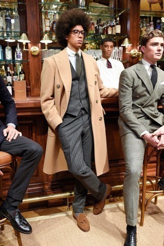 Three Piece Suit Outfits: Pairing a three piece suit with a camel overcoat is a smart idea for a classic and sophisticated getup. As for the shoes, you can follow a more casual route with brown suede tassel loafers.