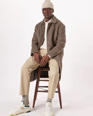 Beige Chinos Cold Weather Outfits: Pair a brown houndstooth overcoat with beige chinos if you're going for a clean, sharp outfit. To add an easy-going feel to your outfit, introduce a pair of white and green leather low top sneakers to your look.