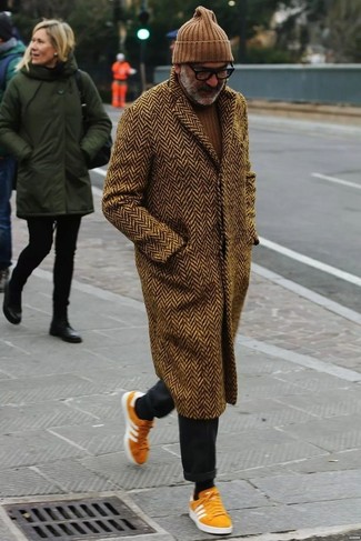 Dark Brown Herringbone Overcoat Outfits: For a casually smart ensemble, try teaming a dark brown herringbone overcoat with charcoal chinos — these two items work nicely together. Rounding off with a pair of orange suede low top sneakers is a simple way to bring a more casual twist to your look.
