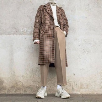 Beige Chinos Cold Weather Outfits: Pair a camel houndstooth overcoat with beige chinos to pull together an interesting and pulled together ensemble. Finishing off with a pair of white athletic shoes is an easy way to inject a more casual vibe into this ensemble.