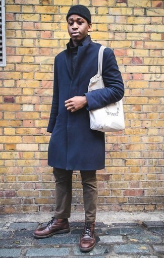 White Print Canvas Tote Bag Outfits For Men: Combining a navy overcoat with a white print canvas tote bag is an on-point idea for a cool and relaxed outfit. Balance out your look with a classier kind of footwear, like this pair of burgundy leather casual boots.