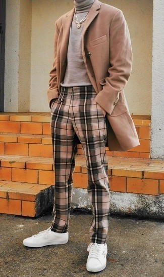 Beige Chinos Chill Weather Outfits: For an ensemble that's effortlessly smart and camera-worthy, consider wearing a camel overcoat and beige chinos. Complete this look with a pair of white canvas low top sneakers to infuse a touch of stylish effortlessness into this look.