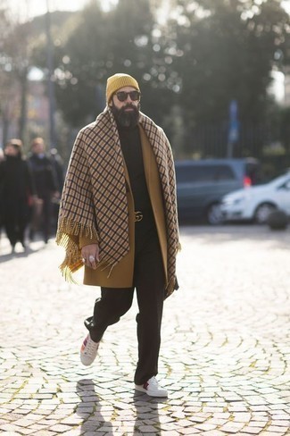 Orange Beanie Outfits For Men: Team a camel overcoat with an orange beanie if you wish to look casually stylish without exerting much effort. When not sure about what to wear when it comes to shoes, stick to white print canvas low top sneakers.