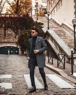 Navy Turtleneck Outfits For Men: A navy turtleneck and navy chinos are worth adding to your list of bona fide casual essentials. Dark brown leather chelsea boots will give an air of polish to an otherwise too-common look.