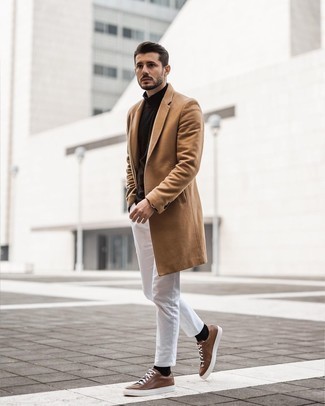 Camel Overcoat Cold Weather Outfits: For an effortlessly classic outfit, dress in a camel overcoat and white chinos — these items work perfectly well together. For times when this ensemble appears all-too-classic, play it down by finishing off with brown leather low top sneakers.