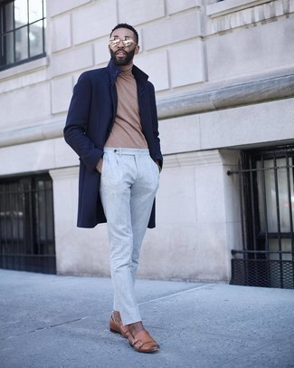 Beige Turtleneck Outfits For Men: This combination of a beige turtleneck and grey chinos makes for the perfect base for an endless number of getups. Rock a pair of tan leather double monks to avoid looking too casual.
