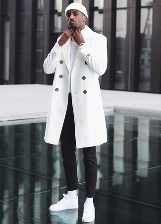 White Overcoat Outfits: Pair a white overcoat with black chinos to exude rugged refinement and class. For times when this outfit is too much, play it down by slipping into white canvas low top sneakers.