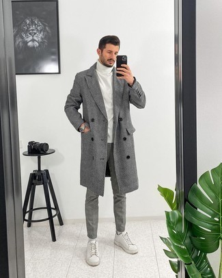 Grey Herringbone Overcoat Outfits: This classic and casual combination of a grey herringbone overcoat and grey chinos is super easy to put together in seconds time, helping you look dapper and ready for anything without spending too much time digging through your closet. White leather low top sneakers will give a laid-back touch to an otherwise dressy ensemble.