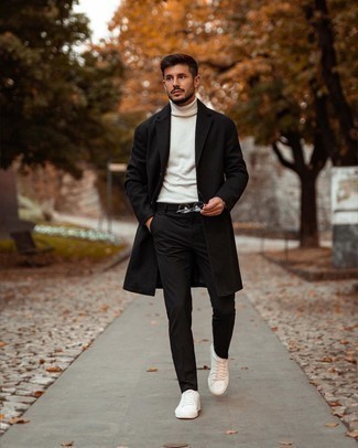 Silver Watch Cold Weather Outfits For Men: Show off your prowess in men's fashion by pairing a black overcoat and a silver watch for a casual ensemble. Look at how well this look goes with a pair of white canvas low top sneakers.