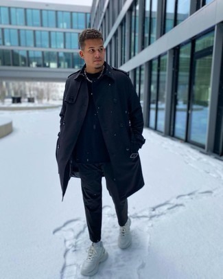 Black Overcoat Outfits: This combo of a black overcoat and navy chinos epitomizes masculine sophistication and versatility. Why not take a more laid-back approach with shoes and complement your ensemble with white athletic shoes?