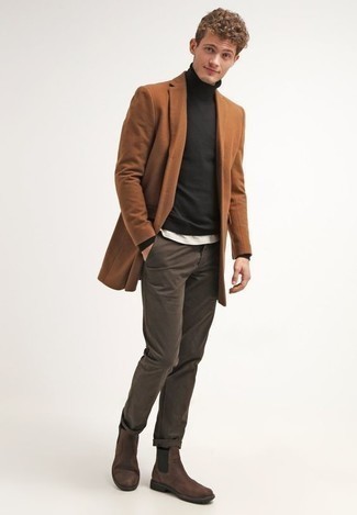 Brown Chinos Cold Weather Outfits: A tobacco overcoat and brown chinos? Be sure, this menswear style will make ladies swoon. With footwear, go for something on the smarter end of the spectrum by finishing off with dark brown suede chelsea boots.