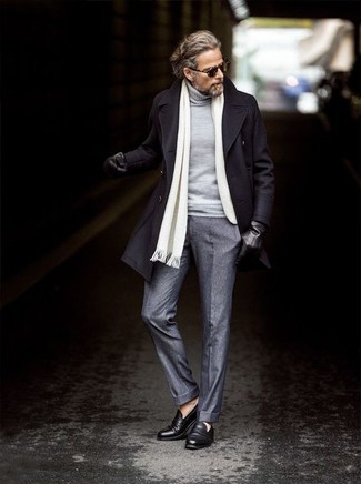 White Scarf Outfits For Men: A black overcoat and a white scarf are a street style pairing that every modern gent should have in his casual routine. Avoid looking too casual by finishing off with black leather loafers.