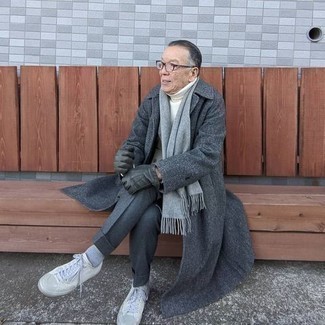 Charcoal Overcoat Outfits After 60: A charcoal overcoat and charcoal dress pants are essential in a polished man's wardrobe. White canvas low top sneakers can easily tone down an all-too-classic look. This one is a modern yet age-appropriate ensemble for older gents.