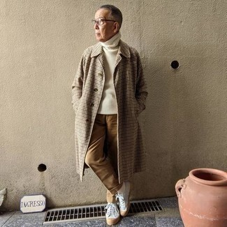 Camel Overcoat Warm Weather Outfits: For a look that's nothing less than camera-worthy, pair a camel overcoat with khaki dress pants. A pair of white canvas low top sneakers will instantly play down a smart ensemble.