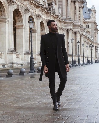 Gold Bracelet Outfits For Men: If you're obsessed with relaxed styling when it comes to your personal style, you'll love this city casual combination of a black overcoat and a gold bracelet. Black leather chelsea boots are a surefire way to infuse a dose of sophistication into this outfit.