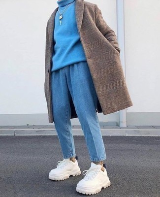 White Athletic Shoes Outfits For Men: This combination of a brown plaid overcoat and light blue jeans is a fail-safe option when you need to look effortlessly refined but have no extra time to spare. To introduce a laid-back vibe to this outfit, complete this outfit with white athletic shoes.