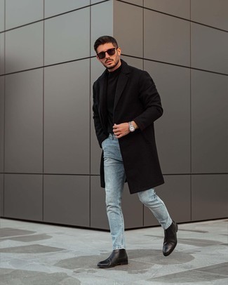 Black Overcoat Outfits: This combo of a black overcoat and light blue jeans is beyond versatile and provides instant polish. You can stick to a more elegant route on the shoe front with black leather chelsea boots.