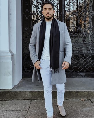 Black Scarf Outfits For Men: A grey overcoat and a black scarf are great menswear must-haves that will integrate really well within your off-duty repertoire. You can get a little creative on the shoe front and add a pair of beige suede chelsea boots to your look.
