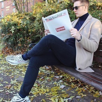 Men's Beige Overcoat, Navy Turtleneck, Navy Jeans, White and Black Athletic Shoes