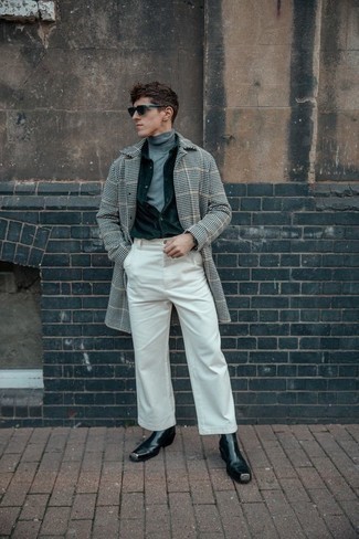 Grey Turtleneck Outfits For Men: Go for a pared down but at the same time cool and casual option by teaming a grey turtleneck and white chinos. To give your overall look a more elegant finish, add black leather chelsea boots to the equation.