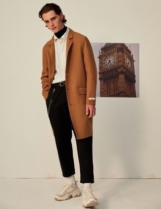 500+ Smart Casual Outfits For Men: A tobacco overcoat and black chinos are the ideal way to infuse some refinement into your day-to-day lineup. Bring a more casual twist to this outfit by finishing off with beige athletic shoes.