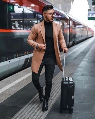Black Suitcase Outfits For Men: A camel overcoat and a black suitcase are the kind of a winning casual ensemble that you need when you have no time. Black leather chelsea boots will infuse a hint of refinement into an otherwise everyday ensemble.