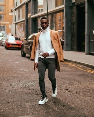White Wool Turtleneck Outfits For Men: Consider pairing a white wool turtleneck with charcoal skinny jeans for comfort dressing with a modern twist. White and black canvas low top sneakers are sure to leave the kind of impression you want to give.
