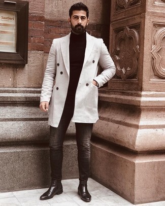 Charcoal Skinny Jeans Outfits For Men: This casual pairing of a white overcoat and charcoal skinny jeans is super easy to pull together in no time flat, helping you look amazing and prepared for anything without spending too much time going through your wardrobe. Clueless about how to complete your outfit? Wear black leather chelsea boots to smarten it up.