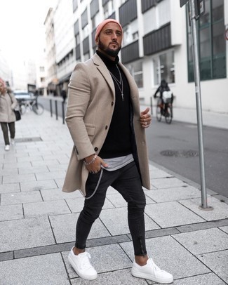 500+ Winter Outfits For Men: If it's comfort and functionality that you're seeking in a look, wear a beige overcoat and black skinny jeans. Hesitant about how to finish off? Add a pair of white canvas low top sneakers to your look to change things up a bit. During winter, when warmth is above all, it can be easy to settle for a less-than-stylish look in the name of functionality. This look, however, is a clear example that you can actually stay warm and remain stylish in winter.