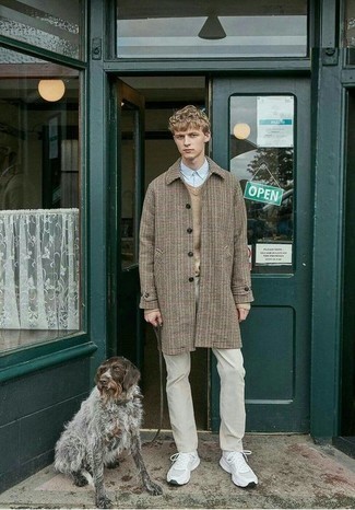 Beige Chinos Cold Weather Outfits: The ultimate choice for casually neat menswear style? A camel houndstooth overcoat with beige chinos. White athletic shoes can instantly play down an all-too-refined look.