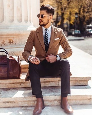 Black Waistcoat Cold Weather Outfits: For a look that's sophisticated and wow-worthy, consider pairing a black waistcoat with dark brown dress pants. Bring a more relaxed twist to an otherwise mostly dressed-up outfit with brown leather chelsea boots.