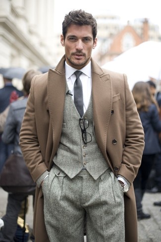 This combination of a camel overcoat and grey herringbone wool dress pants embodies elegance and versatility.