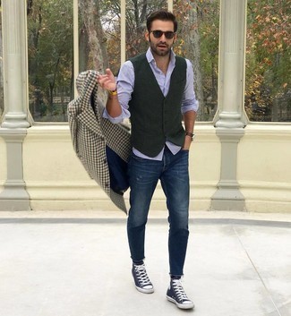 Olive Wool Waistcoat Outfits: An olive wool waistcoat and navy ripped jeans worn together are a sartorial dream for those who prefer polished styles. For something more on the daring side to finish your getup, add navy and white canvas high top sneakers to the mix.
