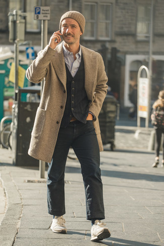 Dark Brown Leather Belt Chill Weather Outfits For Men: Opt for a camel overcoat and a dark brown leather belt to achieve an incredibly stylish and laid-back ensemble. When this look is just too much, dial it down by rounding off with a pair of beige athletic shoes.