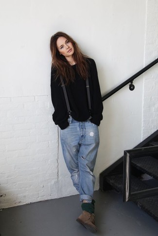 Tobacco Suede Desert Boots Outfits For Women: This absolutely chic casual outfit is ever-so-simple: a black oversized sweater and light blue ripped boyfriend jeans. Finishing off with tobacco suede desert boots is an effortless way to inject an element of class into this look.