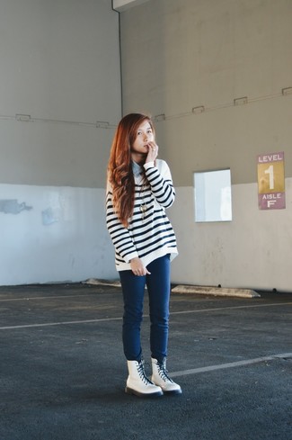 White and Black Horizontal Striped Oversized Sweater Outfits: Extremely chic and functional, this pairing of a white and black horizontal striped oversized sweater and navy skinny jeans will provide you with wonderful styling opportunities. Add white leather lace-up flat boots to your look and you're all set looking spectacular.